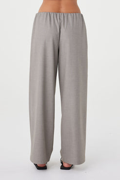 Back view of the Annika Pant in taupe blue pinstripe showcasing the relaxed silhouette, soft drape through the leg and clean slip-on waistband finish