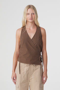 Lilia Wrap Top in Espresso, close front view showing the deep V halter neckline, overlapping wrap front and side tie.