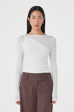 Front view of the Mabel LS Twist Top in Cream featuring an asymmetrical twist neckline, slim fitting silhouette and soft stretch knit, styled with the Manon Pant in Espresso Pinstripe.