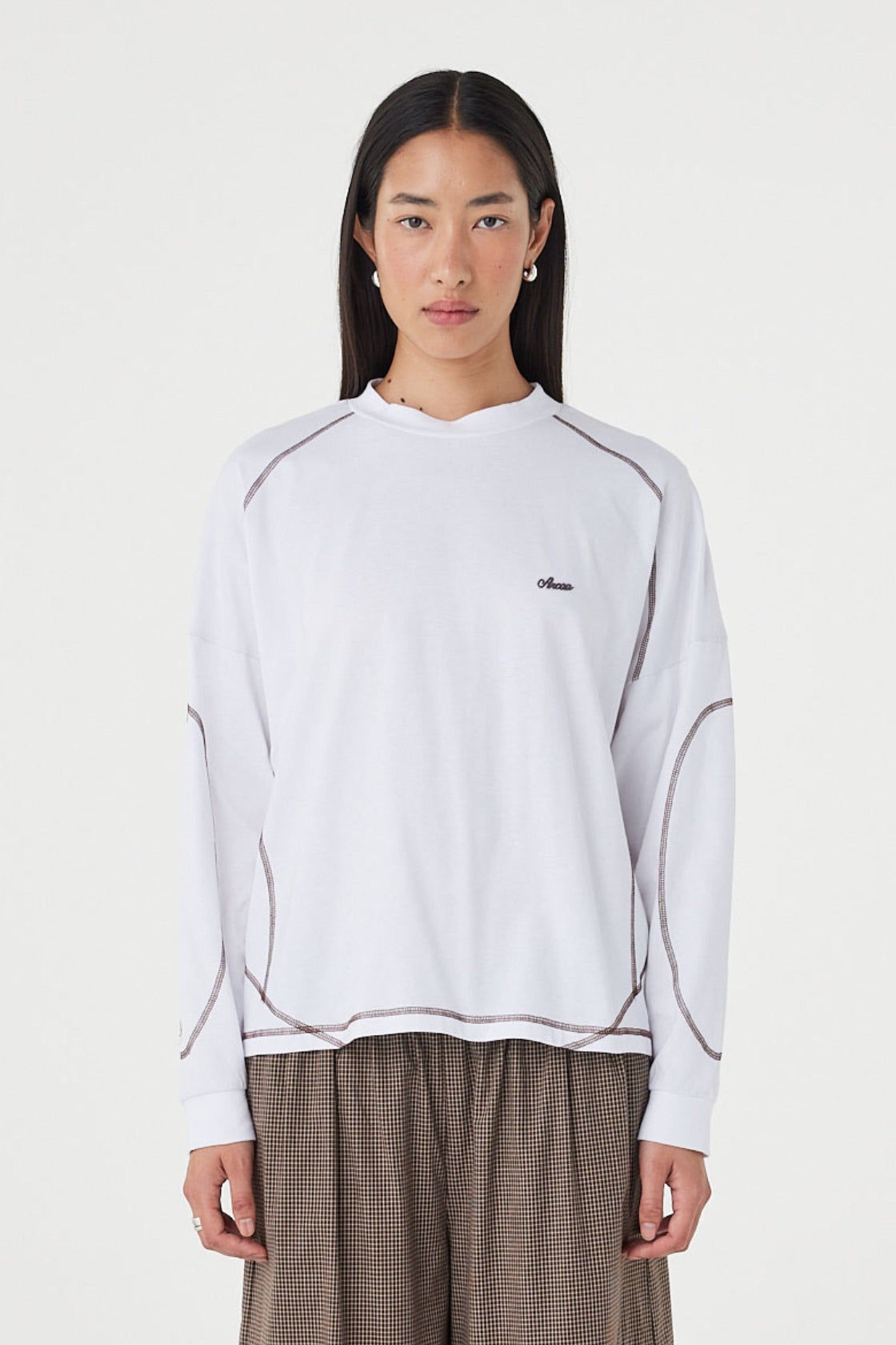 Front view of the Kesh LS Tee in Cream & Espresso featuring contrast overlocking, a relaxed silhouette and dropped shoulders