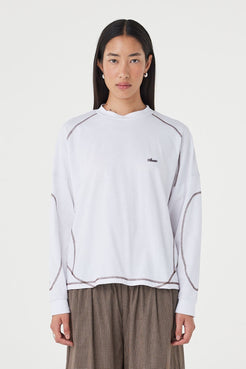 Front view of the Kesh LS Tee in Cream & Espresso featuring contrast overlocking, a relaxed silhouette and dropped shoulders