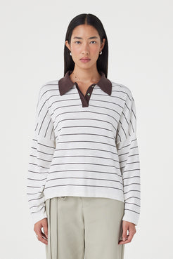 Front view of the Zia Tie Knit Jersey in Cream & Espresso featuring a contrast espresso collar, fine stripe detailing and an oversized organic cotton knit, styled with sage trousers.