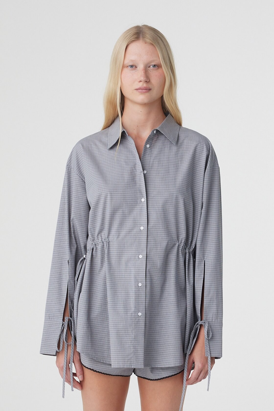 Sia Shirt in Muted Blue Check, close front view showing the oversized shape, button front and adjustable drawstrings at the waist.