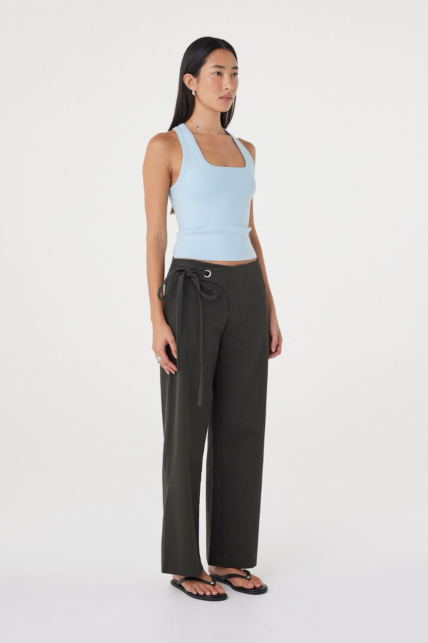 Angled side view of the Lucia Tie Pant in Charcoal highlighting the relaxed fit and tie waistband detail.