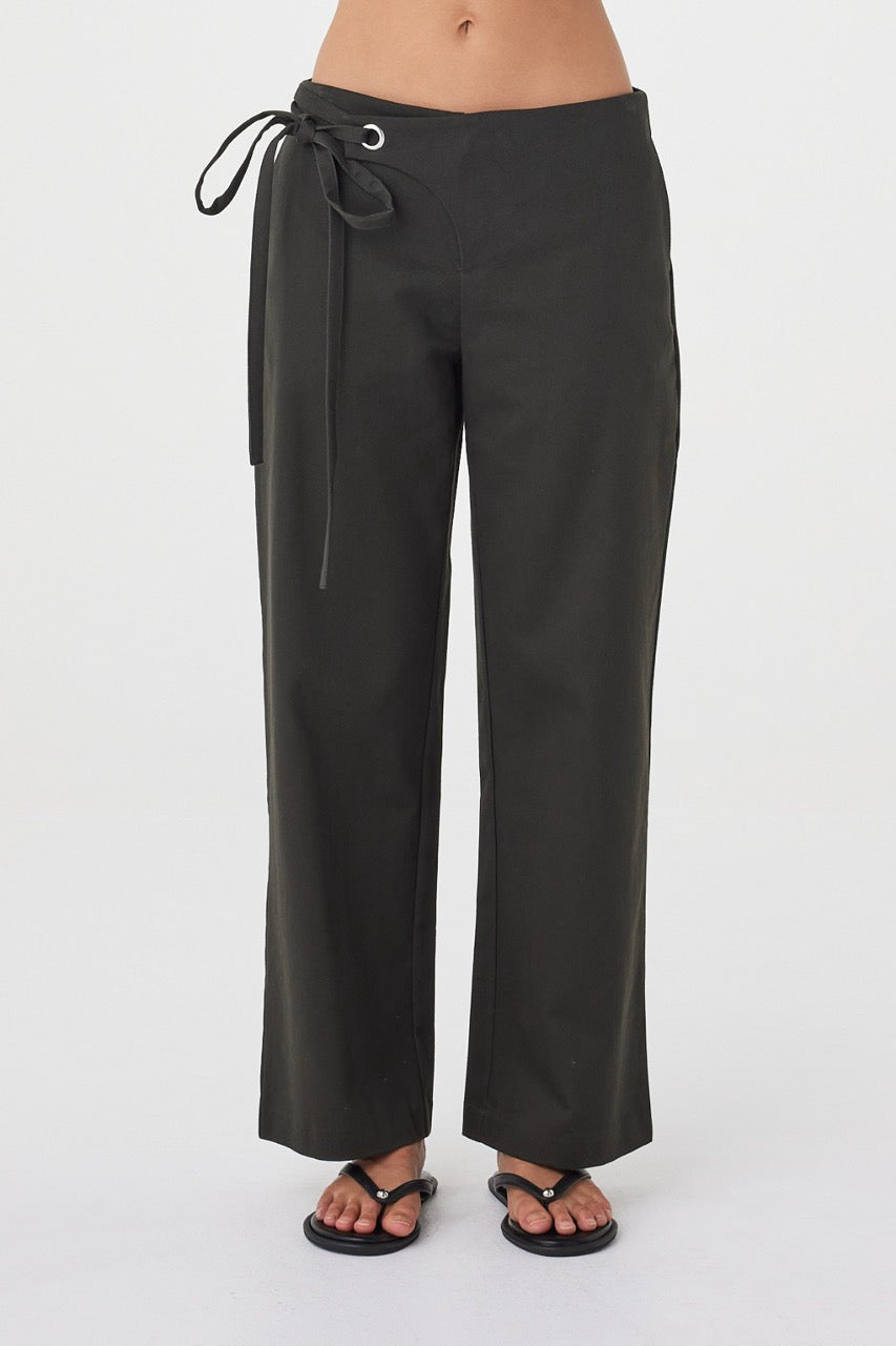Close-up front view of the Lucia Tie Pant in Charcoal highlighting the silver eyelet detail, double ties and front overlap closure.
