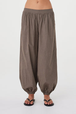 Front view of the Elina Balloon Pant in Chocolate Check showcasing the voluminous leg shape, fixed front waistband and gathered ankle detail.
