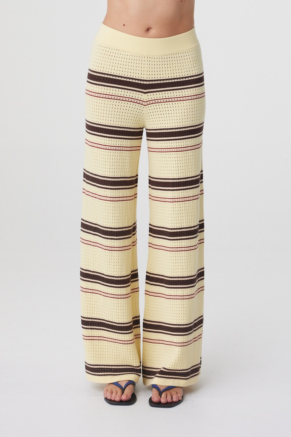 Willa Pant in Butter Espresso Stripe, close front view highlighting the thick elasticated waistband, wide leg shape and horizontal stripe knit.