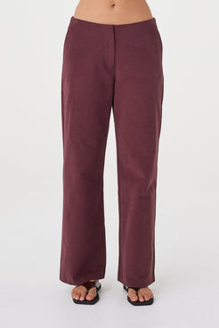 Front view of the Avery Pant in Merlot showcasing the clean waistband and full-length tailored fit.