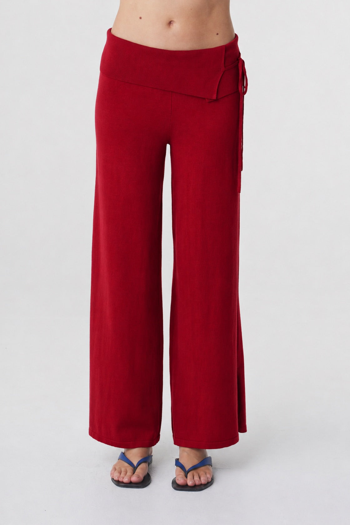 Nora Pant in Chilli, close front view highlighting the mid rise waist, fold over detail, tie and wide leg shape.