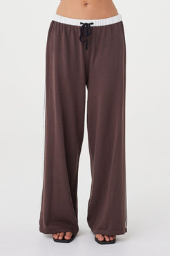 Close-up front view of the Tully Pant in espresso featuring the contrast cream waistband, black drawstring tie and double side stripe detail in cream
