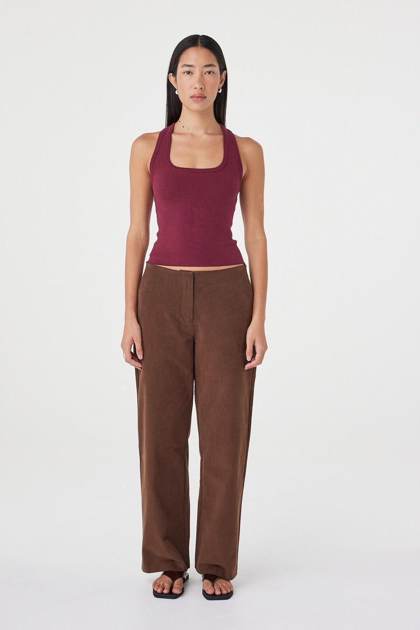 Full-length front view of the Sable Top in merlot styled with espresso straight-leg pants and black sandals, featuring a clean scoop neckline and minimal slim fit