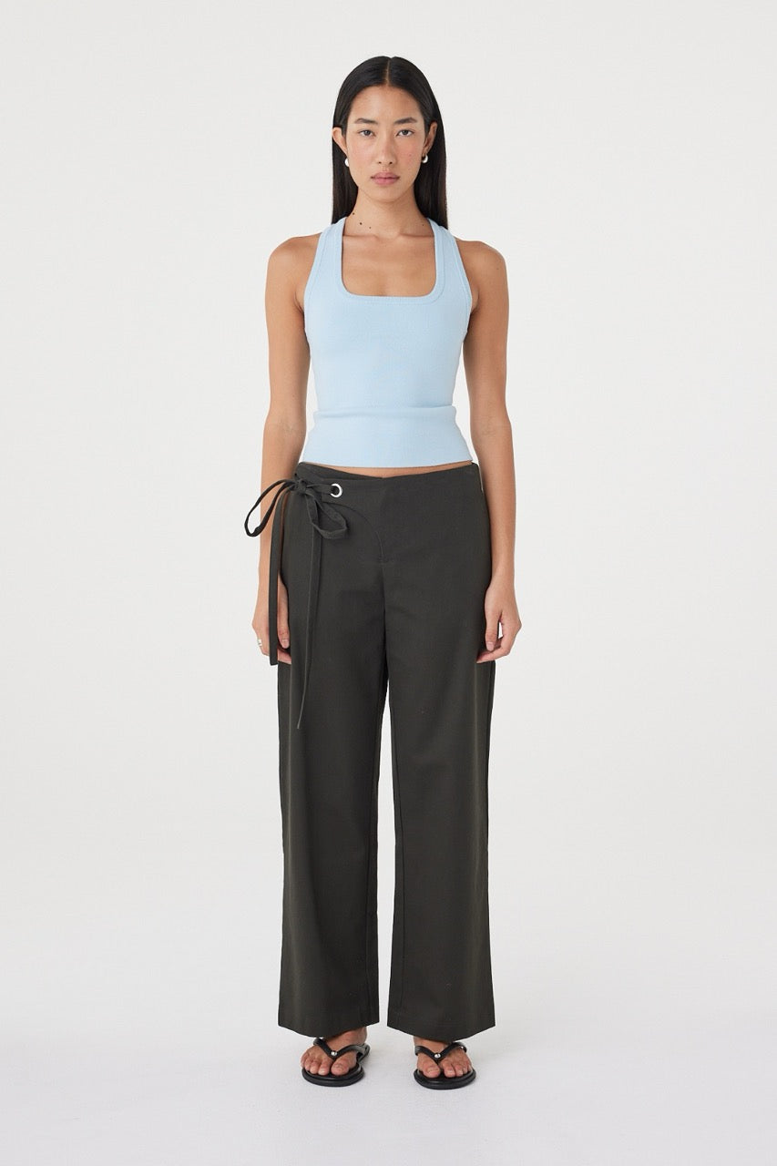 Front view of the Lucia Tie Pant in Charcoal featuring a relaxed straight-leg silhouette, double tie waistband and side seam pockets, styled with the Sable Top in Pale Blue.