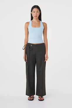 Front view of the Lucia Tie Pant in Charcoal featuring a relaxed straight-leg silhouette, double tie waistband and side seam pockets, styled with the Sable Top in Pale Blue.