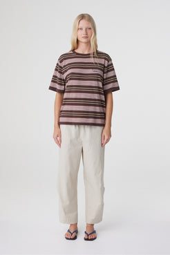 Lena Barrel Pant in Taupe, full front view styled with a striped tee, showing the relaxed cropped barrel leg silhouette.