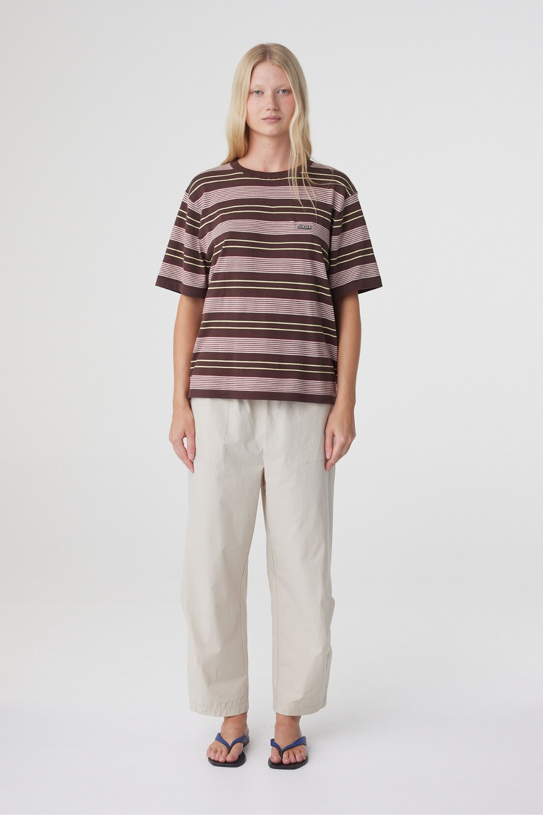 Lena Barrel Pant in Taupe, full front view styled with a striped tee, showing the relaxed cropped barrel leg silhouette.
