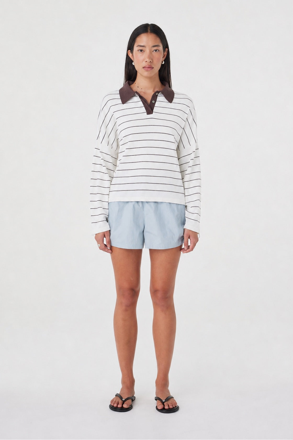 Front view of the Addie Short in Pale Blue featuring an elasticated waistband and adjustable side drawcord, styled with the Zia Tie Knit Jersey in Cream Stripe.