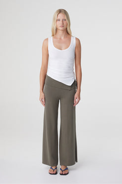 Nora Pant in Smokey Olive, full length front view showing the mid rise asymmetrical waistband and relaxed wide leg silhouette.