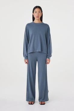 Front view of the Pippa Pant 2.0 in Storm & Cream featuring a relaxed wide-leg silhouette, lightweight linen blend and ribbed waistband, styled with the matching Pippa Longsleeve Tee. 

