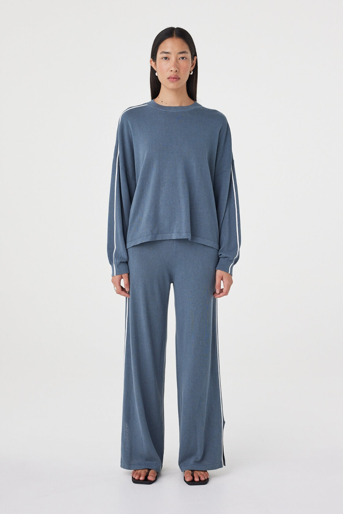 Front view of the Pippa Pant 2.0 in Storm & Cream featuring a relaxed wide-leg silhouette, lightweight linen blend and ribbed waistband, styled with the matching Pippa Longsleeve Tee. 
