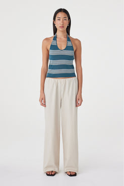 Front full-length view of the Annika Pant in Taupe styled with a blue and cream striped tank and sandals, showing the relaxed wide leg silhouette.