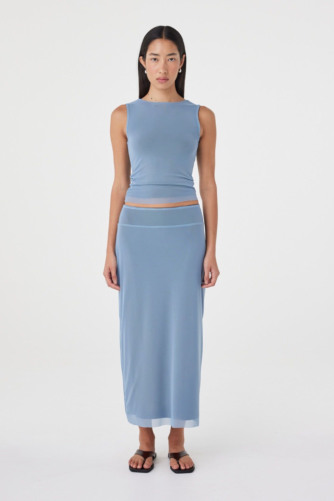 Front view of the Eden Reversible Skirt in Pale Blue & Espresso featuring the pale blue side, longline silhouette and wide waistband, styled with the matching Eden Reversible Top.