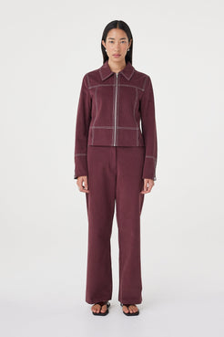 Front view of the Avery Pant in Merlot featuring a relaxed straight-leg silhouette, styled with the matching Benny Jacket in Merlot.