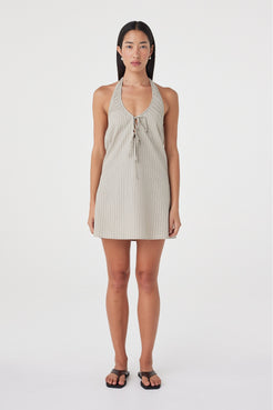 Front view of the Joni Mini Dress in Taupe Stripe featuring a halter neckline, double front tie detail and softly flared A-line silhouette.
