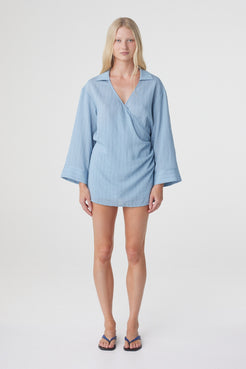 Amara Shirt Dress in Dusk Blue Stripe, full front view showing the oversized silhouette, deep V neckline, wrap front and wide long sleeves.