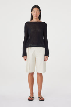 Front view of the Nia LS Top in Black showcasing the wide boat neckline, sheer cotton knit and easy drape through the body.