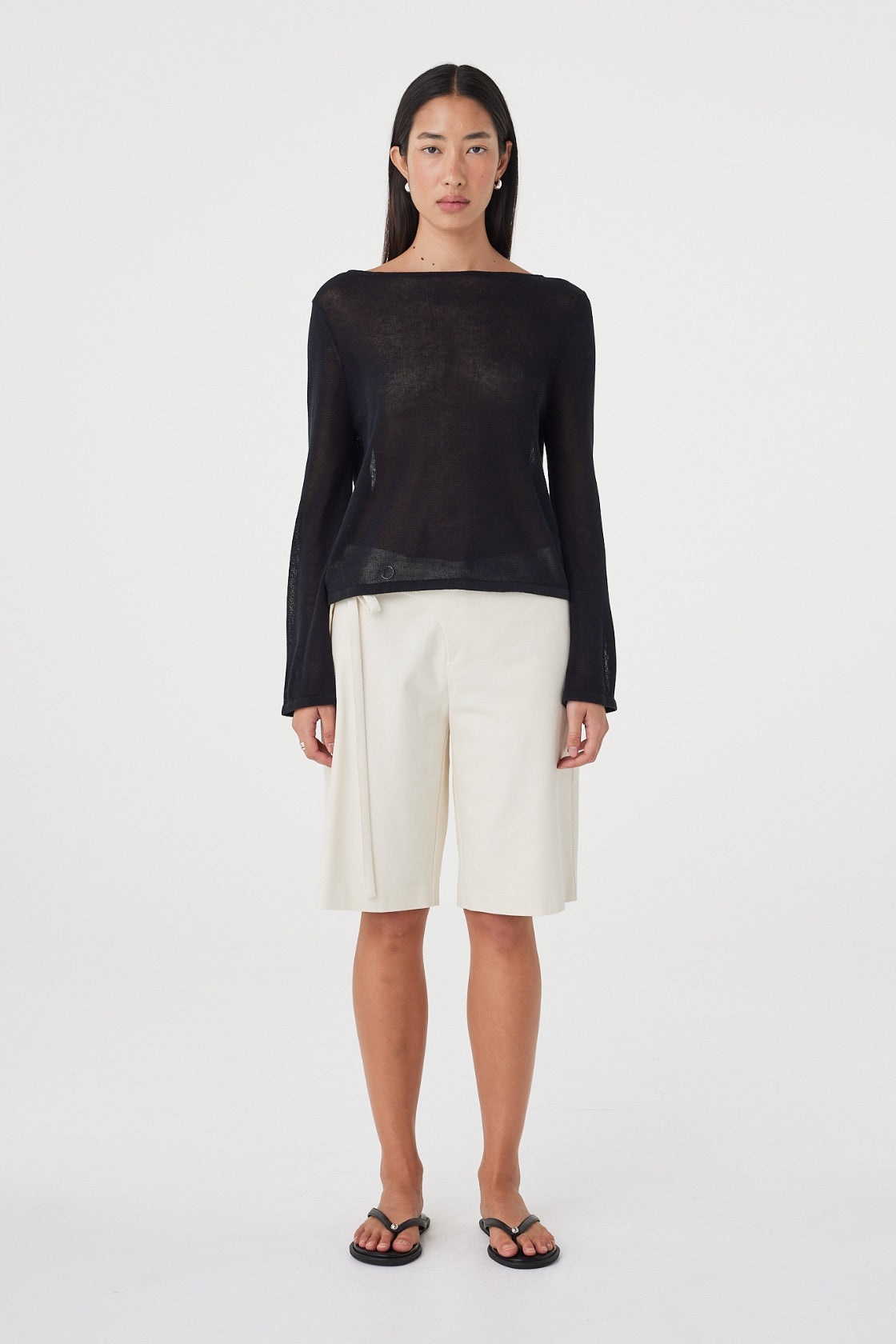 Front view of the Nia LS Top in Black showcasing the wide boat neckline, sheer cotton knit and easy drape through the body.