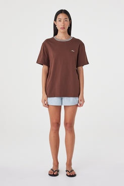 Kylen Tee in Espresso & Cream with pale blue shorts, straight-on front view highlighting the loose shape, short sleeves and contrast neckline.