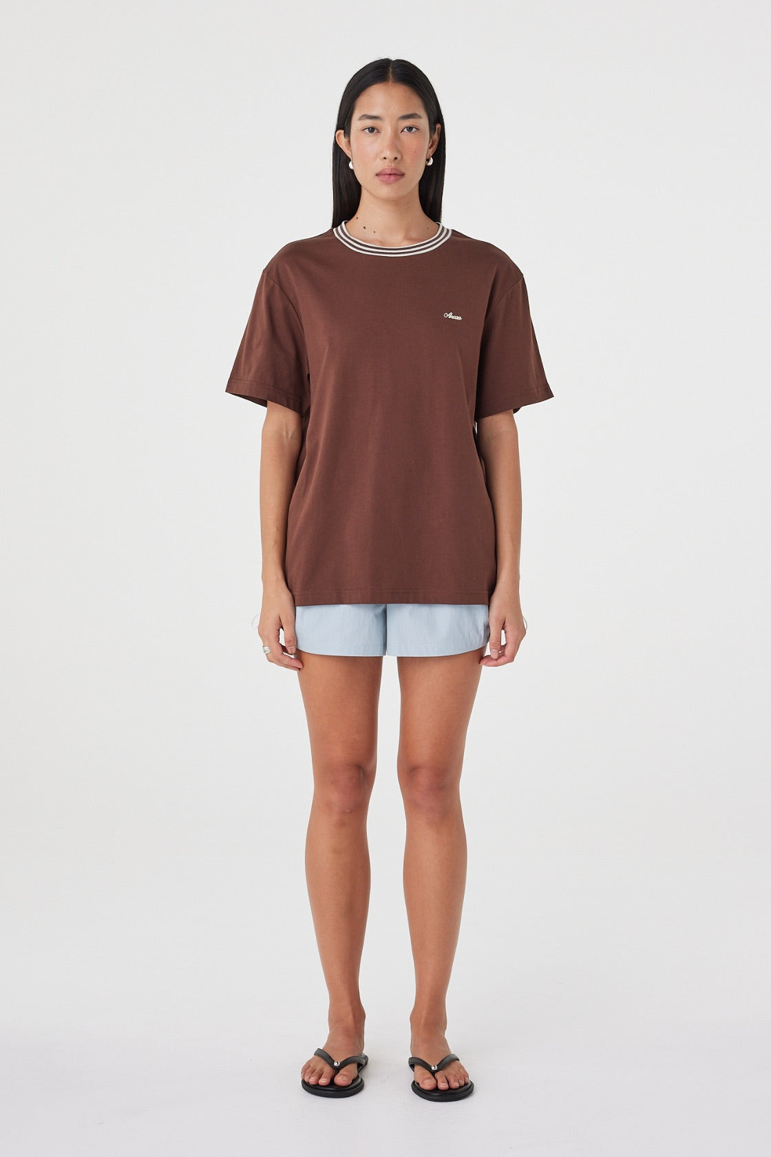 Kylen Tee in Espresso & Cream with pale blue shorts, straight-on front view highlighting the loose shape, short sleeves and contrast neckline.