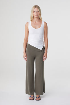Elin Tank in Cream, straight-on front view highlighting the close fit, wide straps and asymmetric finish through the waist.