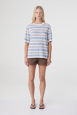 Noor Tee in White & Blue Retro Stripe, straight on front view highlighting the lightweight striped knit and relaxed shape through the body.
