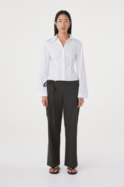 Front view of the Ari Shirt in  White highlighting the collared neckline, button-front design and shaping through the body.
