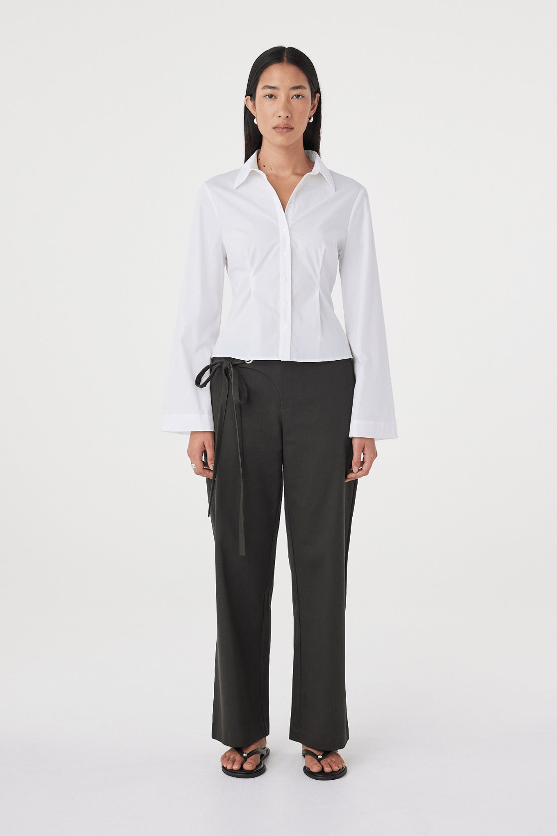 Front view of the Ari Shirt in  White highlighting the collared neckline, button-front design and shaping through the body.
