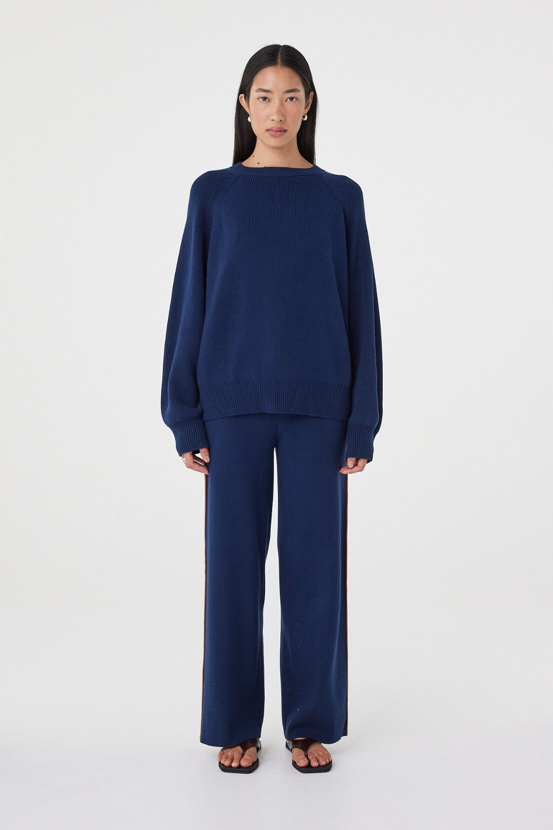 Front view of the Aubrey Sweater in Navy highlighting the softly gathered neckline, oversized proportions and clean knit finish.