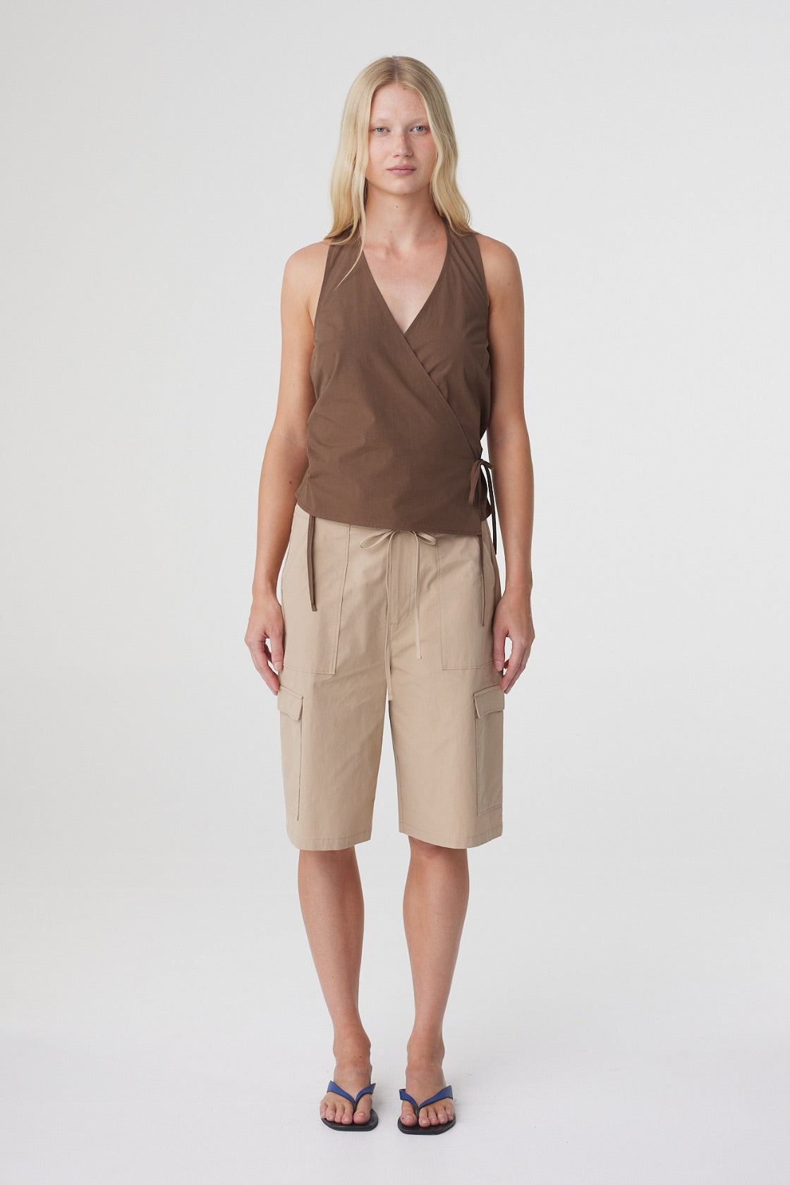 Lilia Wrap Top in Espresso, straight on front view highlighting the wrap construction and tie detail at the waist.