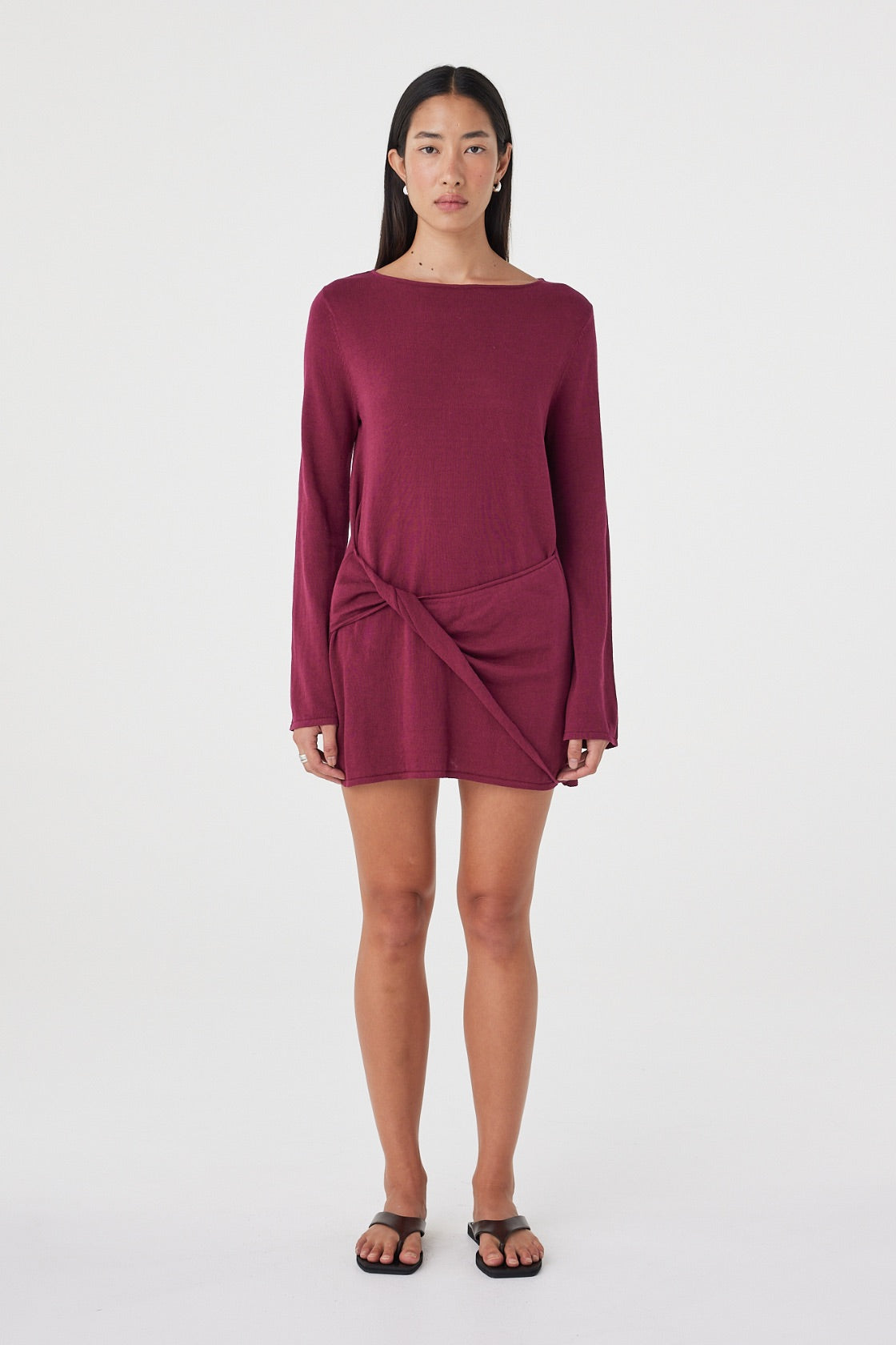 Front view of the Kira Mini Dress in Merlot featuring a boat neckline, twisted wrap panel and long sleeves in a relaxed mini silhouette.