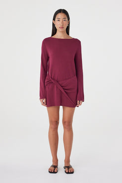 Front view of the Kira Mini Dress in Merlot featuring a boat neckline, twisted wrap panel and long sleeves in a relaxed mini silhouette.