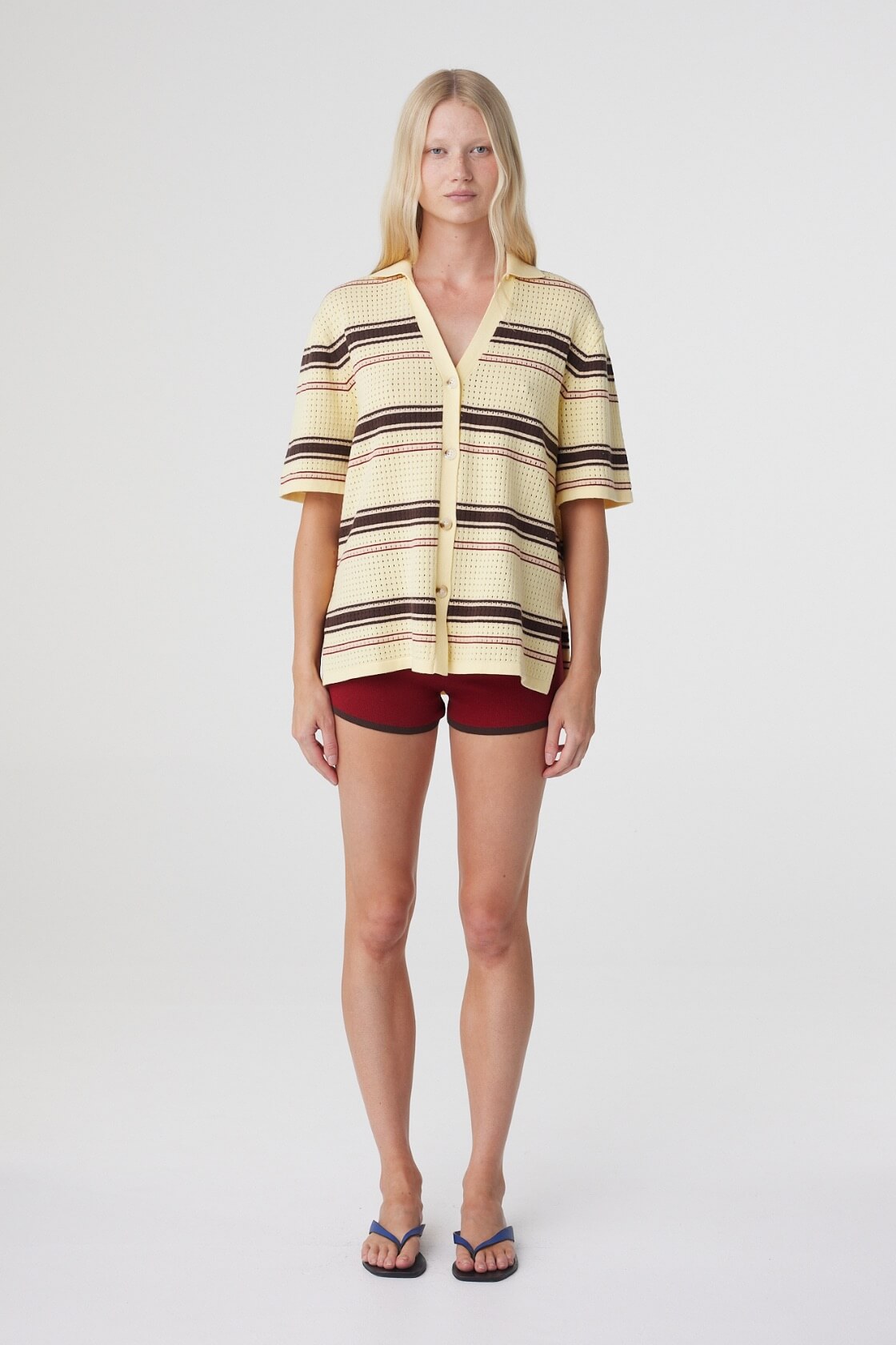 Willa Shirt in Butter Espresso Stripe, straight-on front view styled with burgundy shorts, highlighting the button through front and horizontal stripe knit.