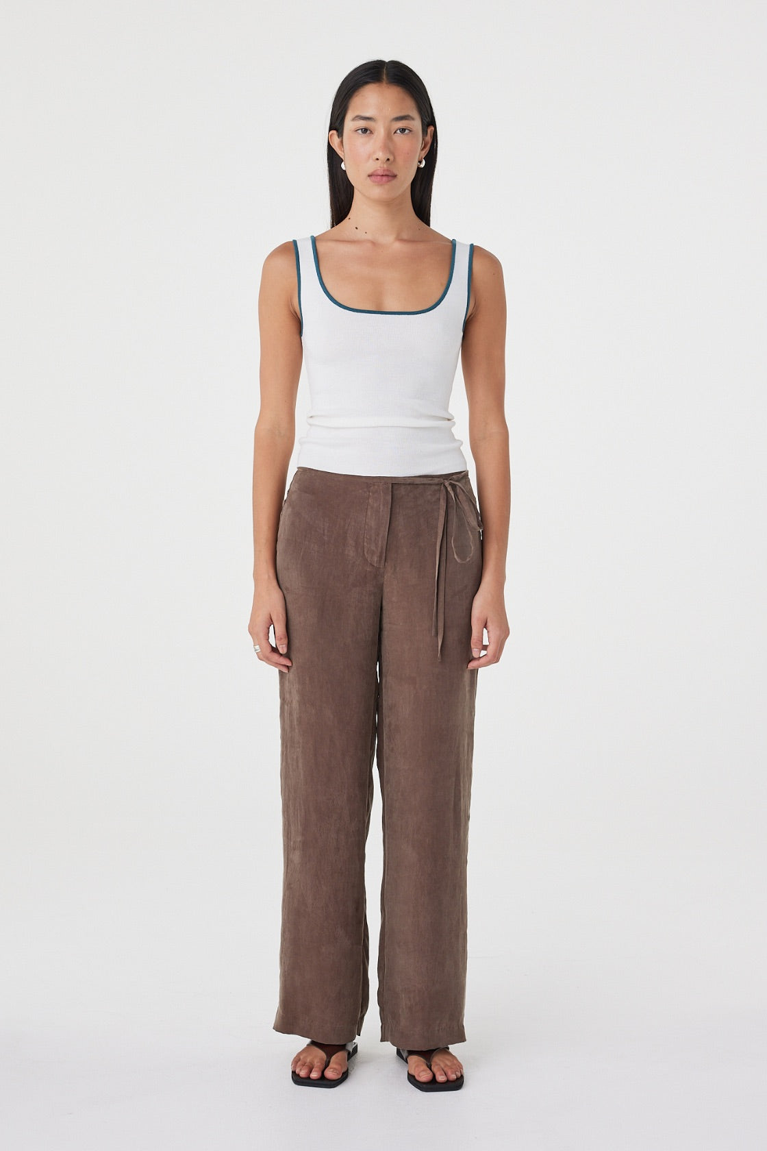 Front view of the Kaya Tank in Cream & Teal highlighting the close-fitting shape, scoop neckline and contrast teal trim.