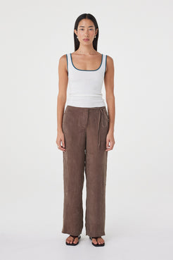 Front view of the Kaya Tank in Cream & Teal highlighting the close-fitting shape, scoop neckline and contrast teal trim.