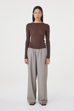 Full-length front view of the Aston LS Top in espresso showcasing the long sleeve silhouette, soft semi-sheer finish and clean boat neckline styling