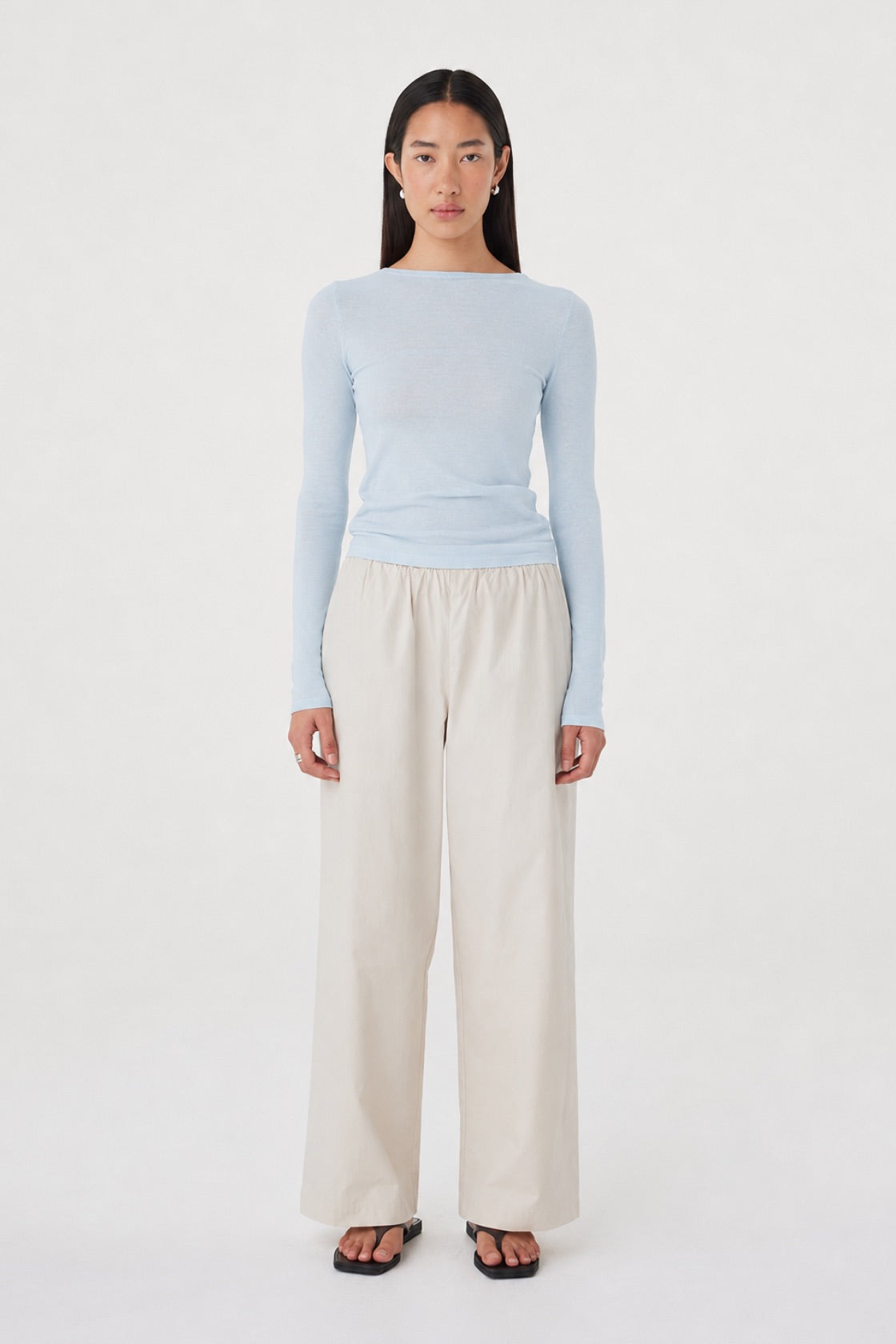 Aston LS Top in Pale Blue styled with the Annika Pants in Taupe, full-length front view showing the slim shape through the body and relaxed wide-leg pants.