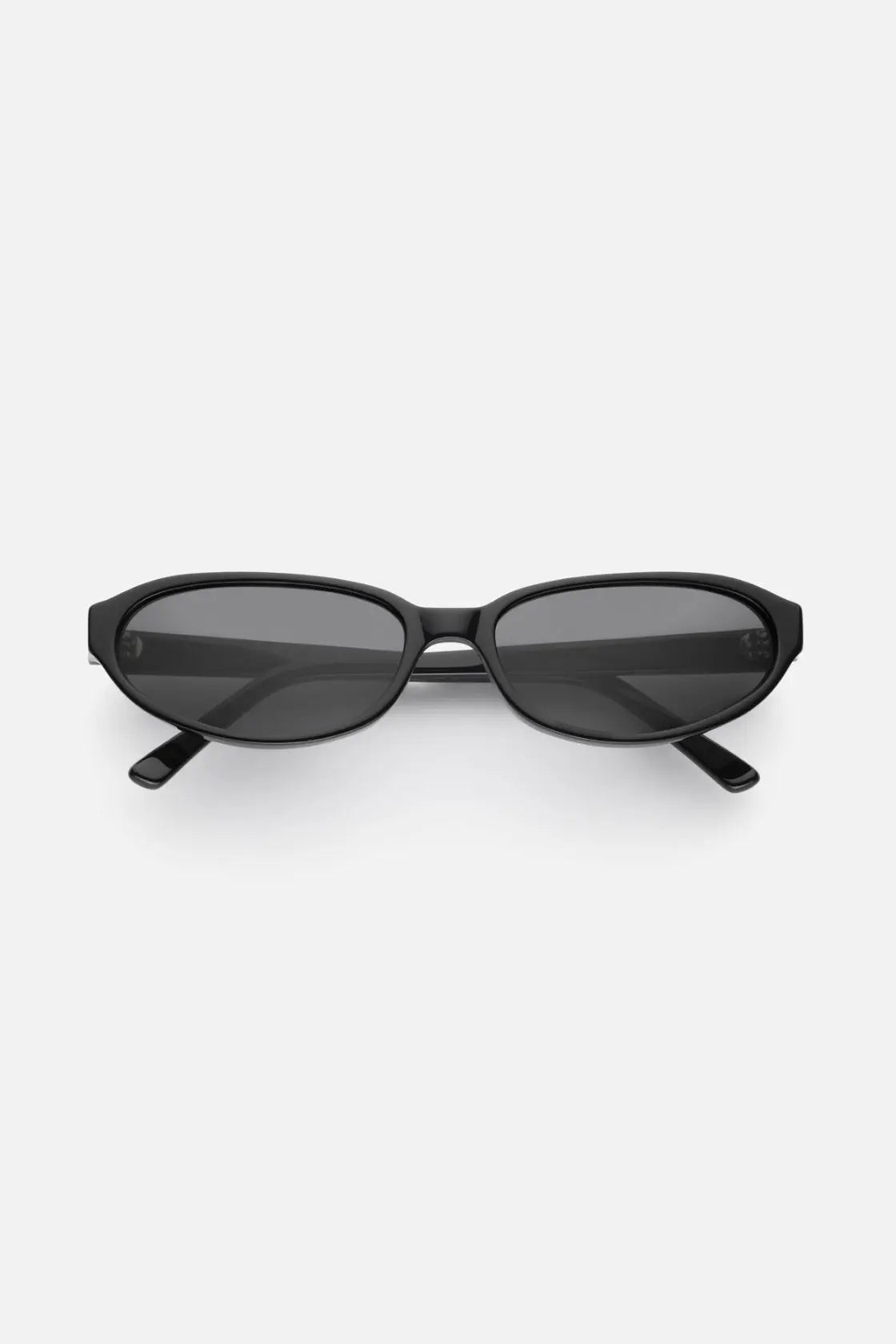 Black oval-frame sunglasses in glossy acetate, with sculpted arms and dark lenses for minimalist everyday styling.