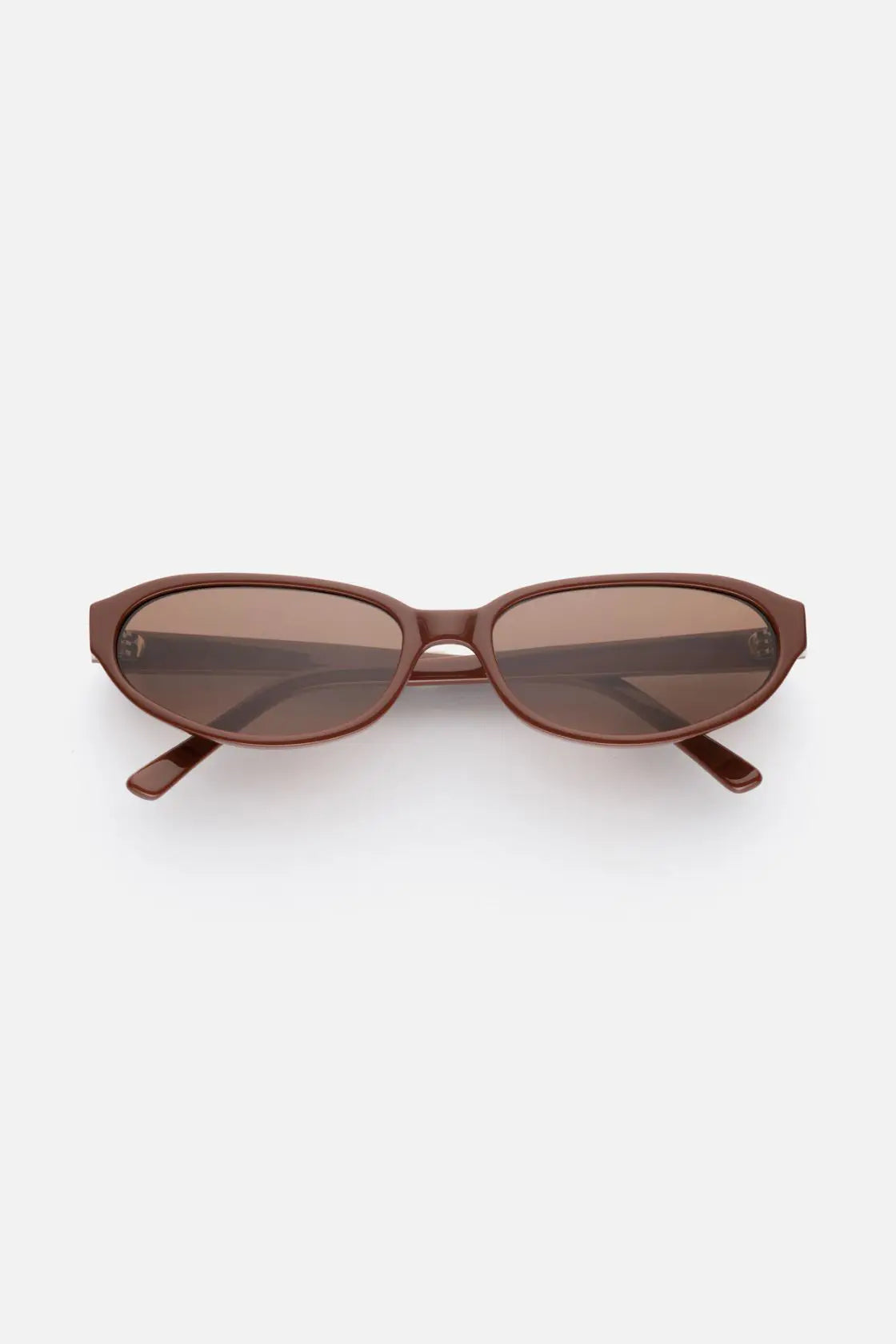 Oval sunglasses in warm cinnamon-hued acetate with tonal brown lenses, finished in a subtle gloss for refined everyday wear.