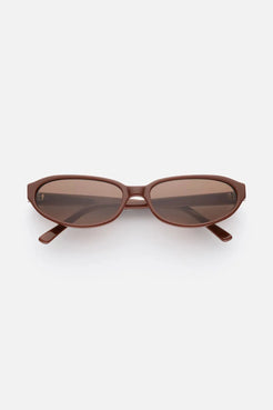 Oval sunglasses in warm cinnamon-hued acetate with tonal brown lenses, finished in a subtle gloss for refined everyday wear.