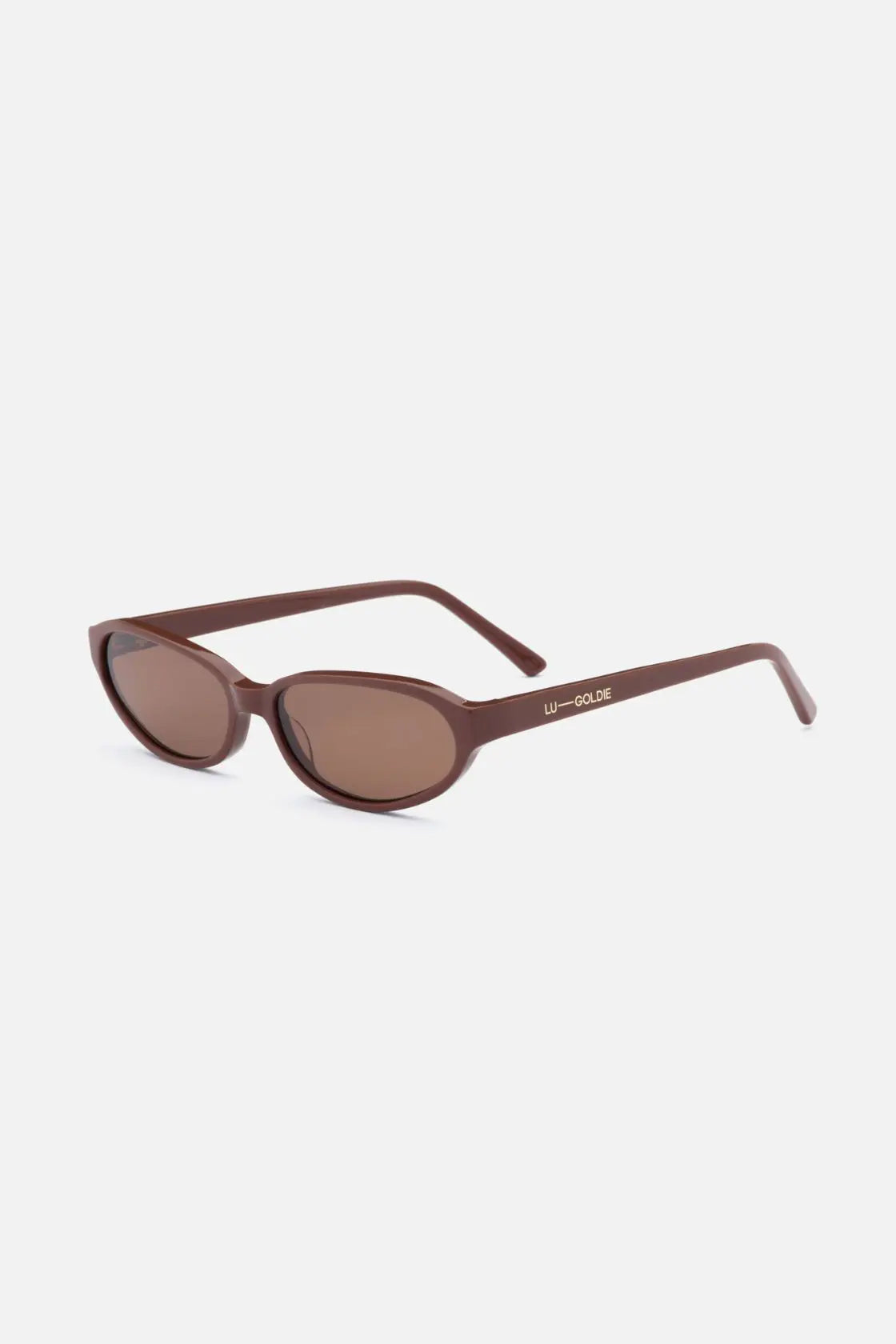 Side angle of cinnamon acetate sunglasses showing soft oval shape, lightweight arms and mid-gloss finish for transitional styling.