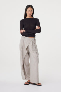 Three-quarter front view of the Calla Pant in Taupe Plaid featuring the metal buckle detail and wide-leg silhouette.